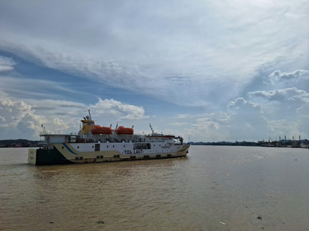 a large boat floating on top of a body of water